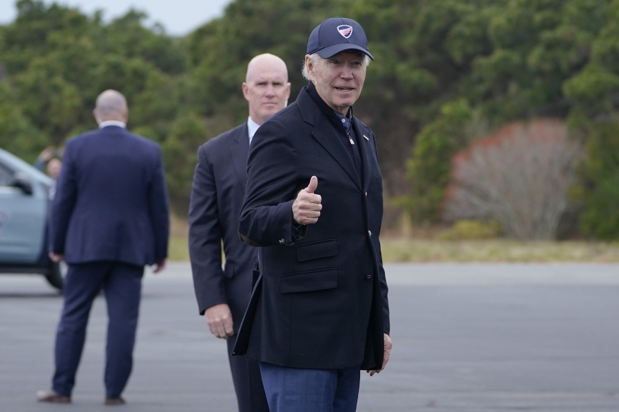President Joe Biden gives a thumbs up before boarding Air Force One at Nantucket Memorial Airport in Nantucket, Mass., Sunday, Nov. 27, 2022. Biden is heading back to Washington after spending the Thanksgiving Day holiday in Nantucket with family.