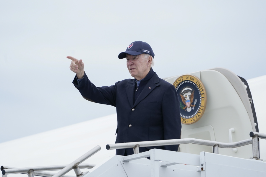 President Joe Biden gestures boarding Air Force One at Nantucket Memorial Airport in Nantucket, Mass., Sunday, Nov. 27, 2022. Biden is heading back to Washington after spending the Thanksgiving Day holiday in Nantucket with family.