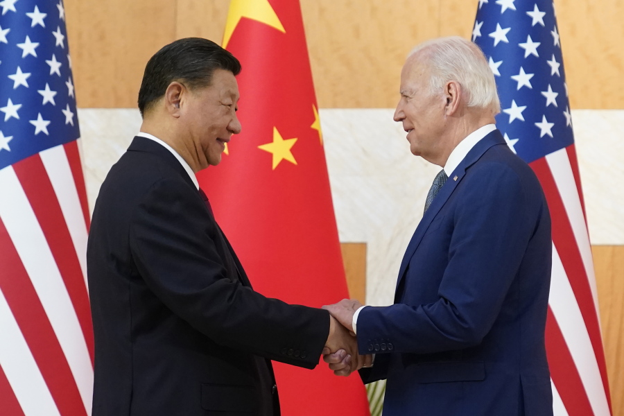 U.S. President Joe Biden, right, and Chinese President Xi Jinping shake hands before their meeting on the sidelines of the G20 summit meeting, Monday, Nov. 14, 2022, in Nusa Dua, in Bali, Indonesia.