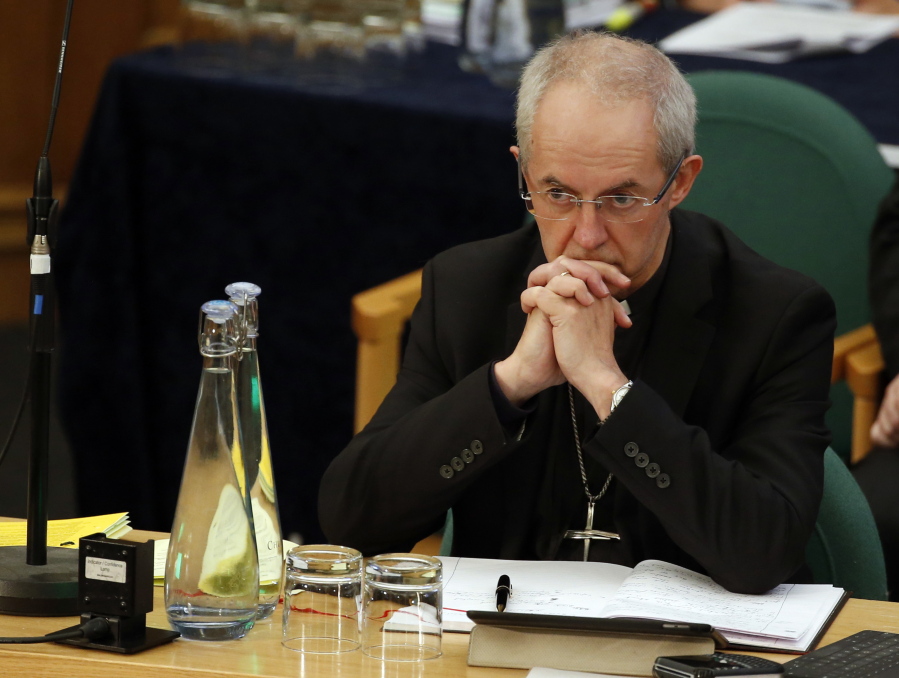 FILE - The Archbishop of Canterbury Justin Welby listens to debate at the General Synod in London, on Feb. 13, 2017. Less than half of people in England and Wales consider themselves Christian, according to the most recent census - the first time the country's official religion has been followed by a minority of the population. Figures from the 2021 census released Tuesday, Nov. 29, 2022, by the Office for National Statistics reveal that Britain has become less religious, and less white, in the decade since the last census in 2011.