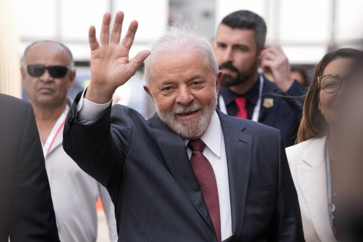 Brazilian President-elect Luiz Inacio Lula da Silva waves as he arrives at the COP27 U.N. Climate Summit, Wednesday, Nov. 16, 2022, in Sharm el-Sheikh, Egypt.