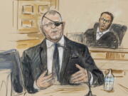 FILE - This artist sketch depicts the trial of Oath Keepers leader Stewart Rhodes, left, as he testifies before U.S. District Judge Amit Mehta on charges of seditious conspiracy in the Jan. 6, 2021, attack on the U.S. Capitol, in Washington, Nov. 7, 2022.  Jury deliberations are expected to begin soon.