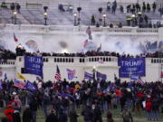 FILE - Violent rioters, loyal to President Donald Trump, storm the Capitol in Washington,  Jan. 6, 2021.