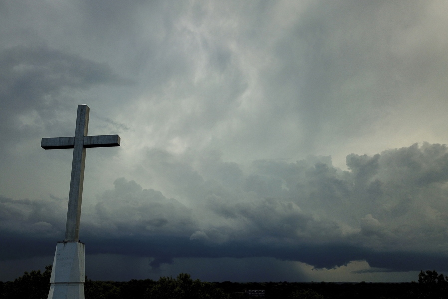 Storm clouds approach a church Aug. 2, 2020, in Mequon, Wis. A new Pew Research Center report published Thursday explores how religion in the U.S. intersects with views on the environment and climate change.