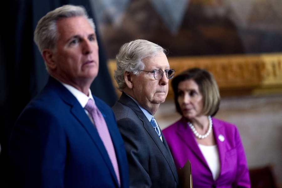 FILE - From left, House Minority Leader Kevin McCarthy of Calif., Senate Minority Leader Mitch McConnell of Ky., and House Speaker Nancy Pelosi of Calif., arrive for a ceremony in the Rotunda of the U.S. Capitol Building in Washington, Sept. 29, 2022.