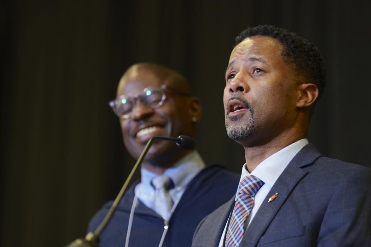 Bishop Cedrick Bridgeforth addresses delegates, guests and his new episcopal colleagues shortly after his election on Nov. 4 at Christ United Methodist Church in Salt Lake City. At left is his husband, Christopher Hucks-Ortiz.