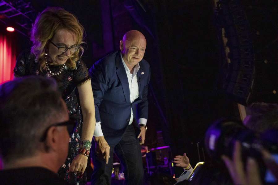 Sen. Mark Kelly, D-Ariz., greets supporters at an election night event in Tucson, Ariz., Tuesday, Nov.