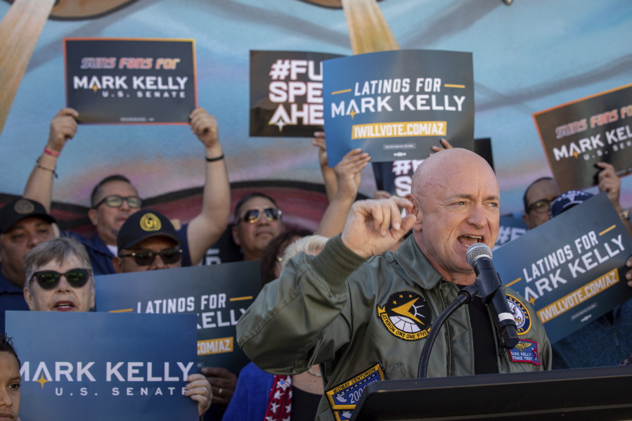 Sen. Mark Kelly, D-Ariz., speaks to supporters at the Barrio Cafe in Phoenix, Saturday, Nov. 12, 2022.