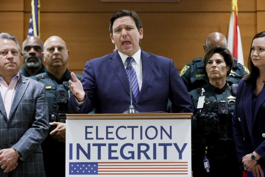 FILE - Florida Gov. Ron DeSantis speaks during a news conference at the Broward County Courthouse in Fort Lauderdale, Fla., Aug. 18, 2022. Florida, Georgia, Texas and Virginia all started new law enforcement units to investigate voter fraud in this year's elections based on former President Donald Trump's lies about the 2020 presidential contest. So far, those units seem to have produced more headlines than actual cases.