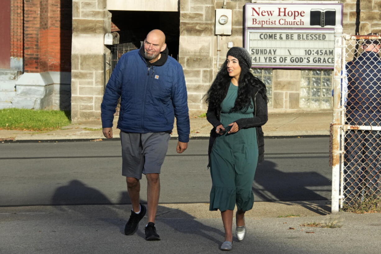 FILE - Pennsylvania Lt. Gov. John Fetterman and wife Gisele arrive to vote in Braddock, Pa, Tuesday, Nov. 8, 2022. When Fetterman goes to Washington in January, one of the Senate's new members will bring along an irreverent style from Pennsylvania that extends from his own personal dress code -- super casual -- to hanging marijuana flags outside his current office in Pennsylvania's state Capitol. (AP Photo/Gene J.