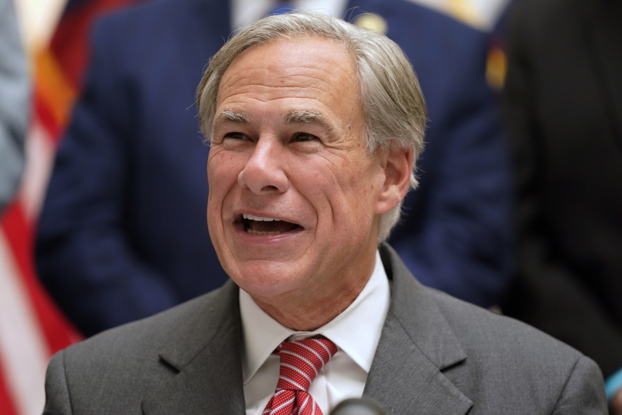 FILE - Republican Texas Gov. Greg Abbott speaks before signing Senate Bill 1, also known as the election integrity bill, into law in Tyler, Texas, Sept. 7, 2021.