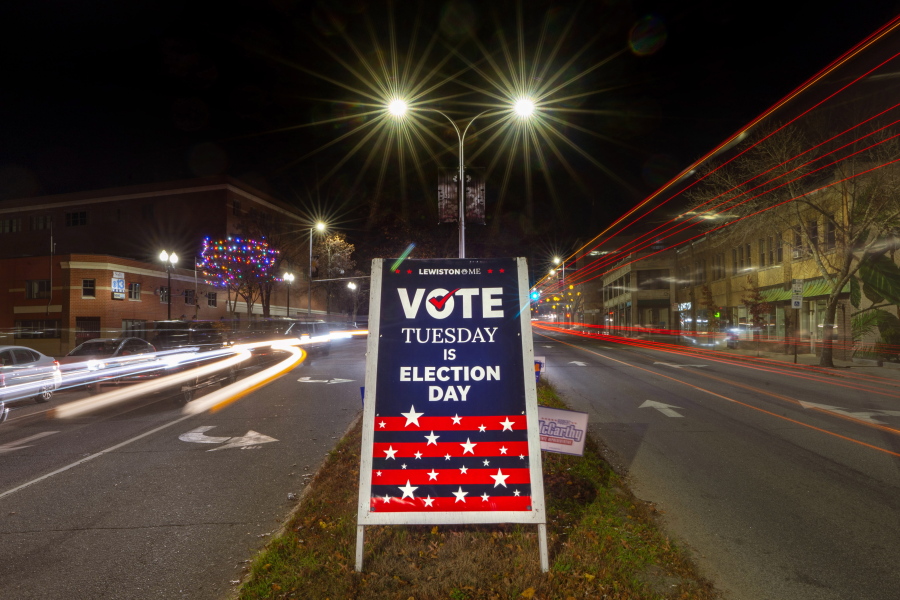 A sign reminds residents to do their civic duty on Election Day, Tuesday, Nov. 8, 2022, in Lewiston, Maine. (AP Photo/Robert F.