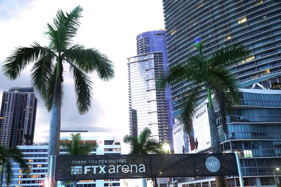 Signage for the FTX Arena, where the Miami Heat basketball team plays, is visible Saturday, Nov. 12, 2022, in Miami. Sam Bankman-Fried received numerous plaudits as he rapidly achieved superstar status as the head of cryptocurrency exchange FTX: the savior of crypto, the newest force in Democratic politics and potentially the world's first trillionaire. Now the comments about the 30-year-old aren't so kind after FTX filed for bankruptcy protection Friday, Nov. 11 leaving his investors and customers feeling duped and many others in the crypto world fearing the repercussions.