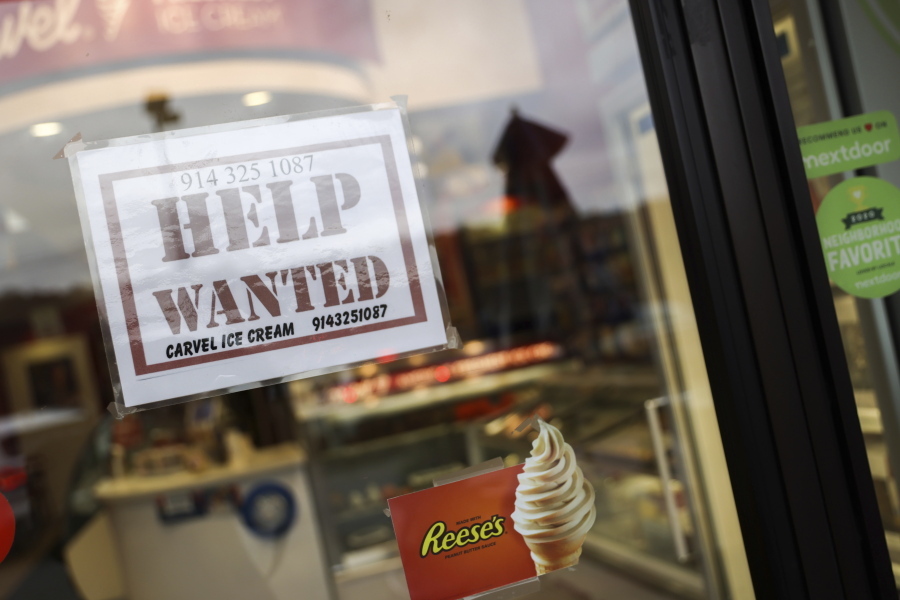 A help wanted sign in a storefront, Tuesday, Nov. 1, 2022, in Bedford, N.Y. The Federal Reserve may reach a turning point this week as it announces what's expected to be another substantial three-quarter-point hike in its key interest rate. The Fed's hikes have already led to much costlier borrowing rates, ranging from mortgages to auto and business loans.