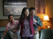 From left, Stephanie Hsu, Michelle Yeoh and Ke Huy Quan in "Everything Everywhere All At Once." (Allyson Riggs/A24 Films)