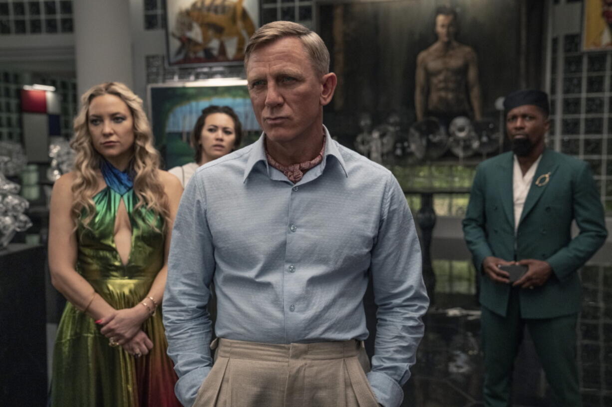 This image released by Netflix shows Kate Hudson, from left, Jessica Henwick, Daniel Craig and Leslie Odom Jr.