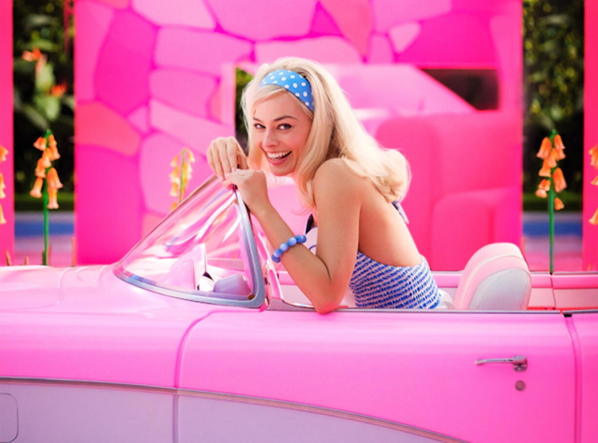 This image released by Warner Bros. Pictures shows Margo Robbie in character in the film "Barbie," releasing summer 2023. (Jaap Buitendijk/Warner Bros.