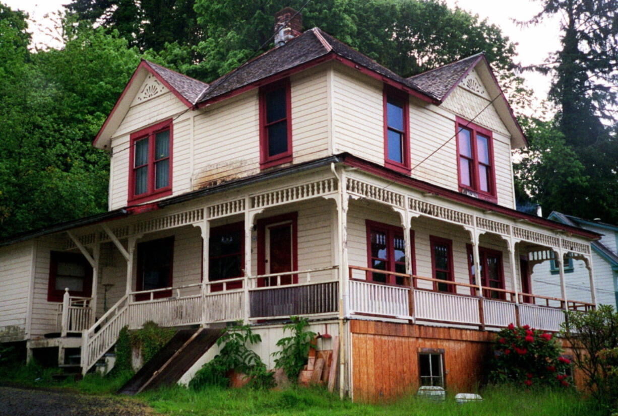 FILE - The house featured in the Steven Spielberg film "The Goonies" is seen in Astoria, Ore., on May 24, 2001. The Victorian home, built in 1896 with sweeping views of the Columbia River as it flows into the Pacific Ocean, is now for sale has been listed with an asking price of $1.7 million. Since the film was released in 1985, fans have flocked to the home, and the owner has long complained of constant crowds and trespassing.