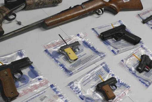 FILE - A collection of illegal guns is displayed during a gun buyback event, Saturday May 22, 2021 in the Brooklyn borough of New York. Individuals received pre-paid card payments of $25 up to $250 for firearms - with a bonus iPad for certain handguns or assault rifles, at the no-questions-asked event, co-sponsored by state and county attorney generals and the NYPD. According to a study published by JAMA Network Open on Tuesday, Nov. 29, 2022, the U.S. gun death rate in 2021 hit its highest mark in nearly three decades, and the rate among women has been growing faster than that of men.