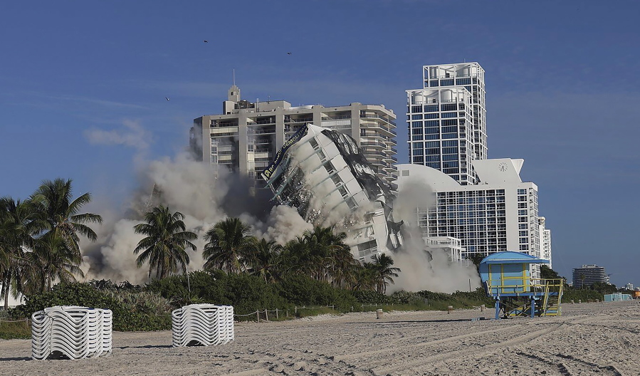 On Sunday, Nov. 13, 2022 Miami Beach's 17-story hotel tower of the historic Deauville Beach Resort implodes  sending dust full of debris into the oceanside luxury buildings.