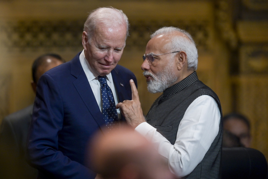 U.S. President Joe Biden, left, talks with India's Prime Minister Narendra Modi during the G20 Summit in Nusa Dua, Bali, Indonesia, Tuesday Nov. 15, 2022.