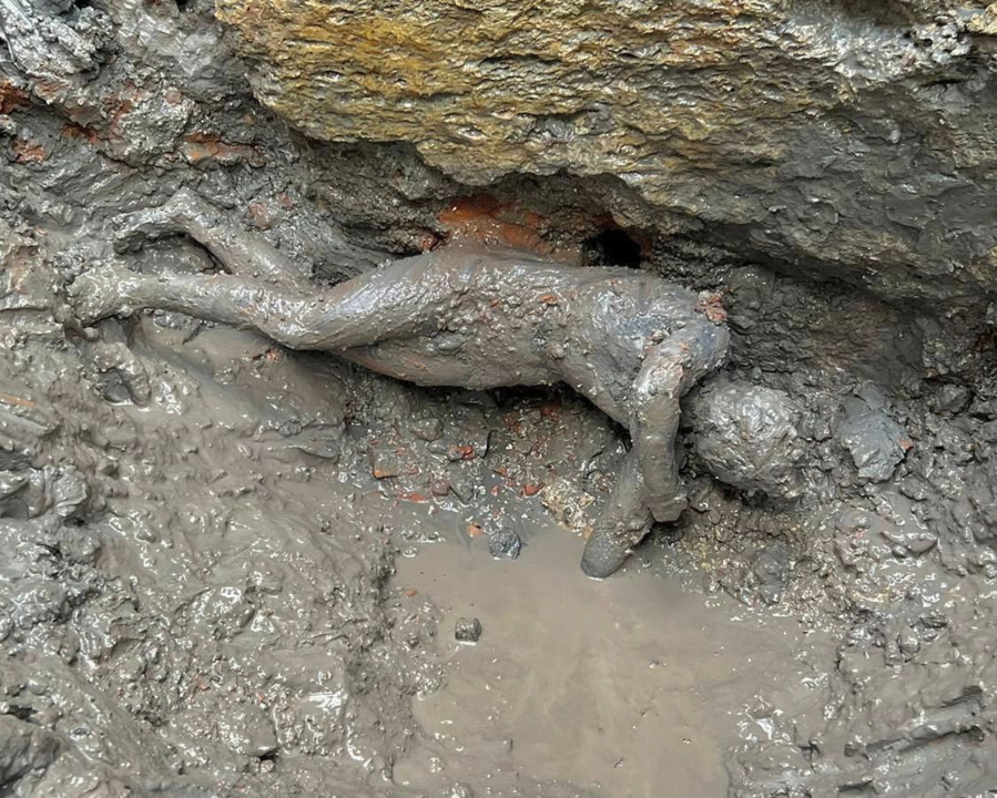 A statue is seen at the site of the discovery of two dozen well-preserved bronze statues from an ancient Tuscan thermal spring in San Casciano dei Bagni, central Italy, in this undated photo made available by the Italian Culture Ministry, Thursday, Nov. 3, 2022.