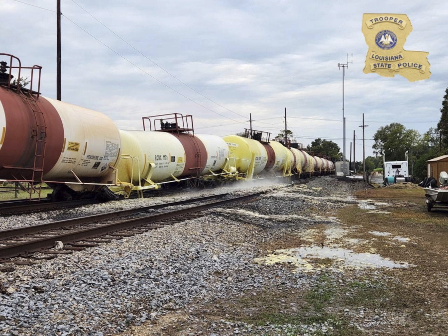 This photo provided by Louisiana State Police shows a railcar leaking hydrochloric acid in St. James Parish, La., on Wednesday, Nov. 2, 2022, according to the police. The derailment of six train cars and a subsequent acid leak prompted road closures and evacuations Wednesday in a Louisiana community, officials said.