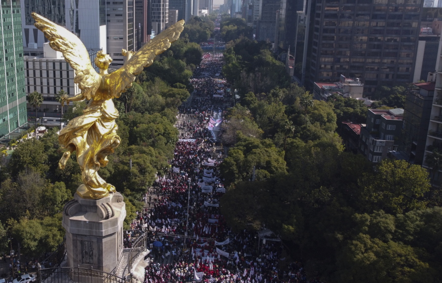 Supporters of Mexican President Andres Manuel Lopez Obrador march in Mexico City, Sunday, Nov. 27, 2022.