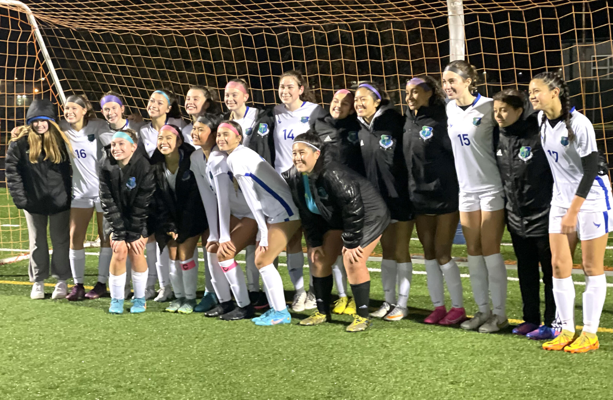 Mountain View players pose for a photo after defeating Kelso 2-0 in the 3A bi-district girls soccer game on Nov. 3, 2022, at District Stadium in Battle Ground.
