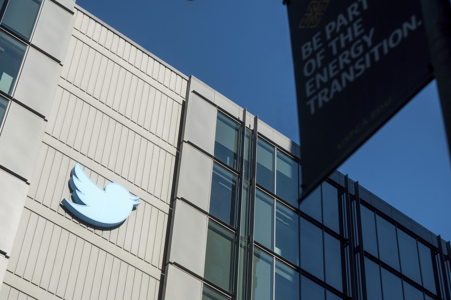 A Twitter logo hangs outside the company's San Francisco offices on Tuesday, Nov. 1, 2022. Employees were bracing for widespread layoffs at Twitter Friday, Nov. 4,  as new owner Elon Musk overhauls the social platform.