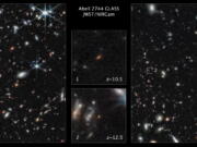 This image made available by the Space Telescope Science Institute on Thursday shows two of the farthest galaxies seen to date captured by the James Webb Space Telescope in the outer regions of the giant galaxy cluster Abell 2744. The galaxies are not inside the cluster, but many billions of light-years farther behind it. The galaxy labeled "1" existed only 450 million years after the big bang. The galaxy labeled "2" existed 350 million years after the big bang. (NASA, ESA, CSA, Tommaso Treu (UCLA), Zolt G.