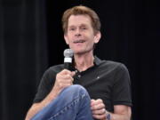 FILE - Kevin Conroy participates during a Q&A panel at Wizard World on Aug. 24, 2019, in Chicago. Conroy, the prolific voice actor whose gravely voice on the "Batman: The Animated Series" was for many Batman fans the definite sound of the Caped Crusader, died Thursday after a battle with cancer. He was 66. Warner Bros., which produced the series, announced Friday.