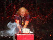 FILE - Comedian Gallagher smashes strawberry syrup and flour at the end of his performance at the Five Flags Theater in Dubuque, Iowa on In this Nov. 18, 2006. Gallagher, the smash-,??em-up comedian who left a trail of laughter, anger and shattered watermelons over a decadeslong career, died Friday at his home in Palm Springs, Calif., after a brief illness. He was 76.