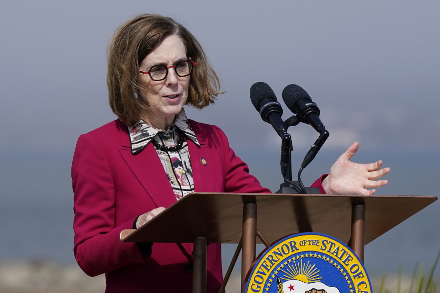 FILE - Oregon Gov. Kate Brown speaks in San Francisco, on Oct. 6, 2022. Gov. Brown is pardoning an estimated 45,000 people convicted of simple possession of marijuana, a month after President Joe Biden did the same under federal law.