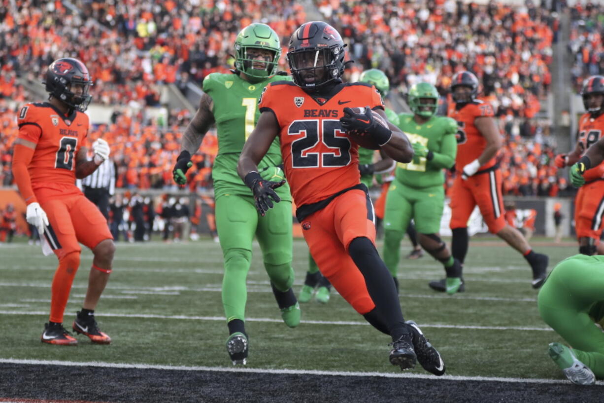 Oregon State running back Isaiah Newell (25) scores a touchdown against Oregon during the second half of an NCAA college football game on Saturday, Nov 26, 2022, in Corvallis, Ore.