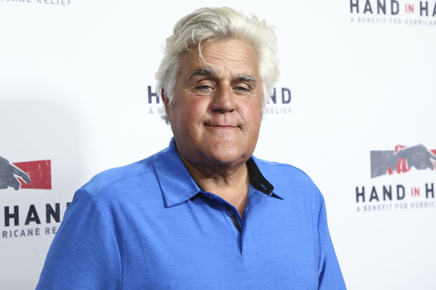 FILE - Jay Leno attends the Hand in Hand: A Benefit for Hurricane Harvey Relief in Los Angeles on Sept. 12, 2017. Jay Leno suffered burns in a weekend fire at the car enthusiast's garage but said Monday that he was doing OK, according to reports.