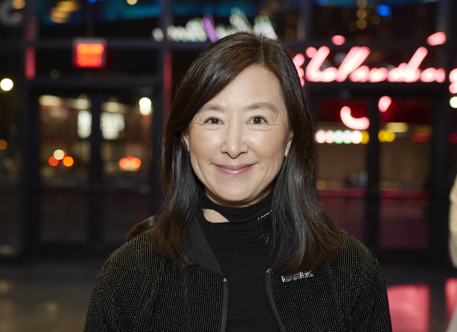 In this photo photo provided by DKC News, Clara Wu Tsai, co-owner of the Brooklyn Nets, stands in front of the Barclays Center in Brooklyn borough of New York in 2021. Wu Tsai launched the largest business accelerator for minority founders of early-stage startups on Monday, Nov. 7, 2022. Named BK-XL, the accelerator will invest up to $500,000 to 12 startups led by Black, Indigenous and other minority founders in 2023.