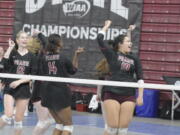 Prairie volleyball players Claire Neuman (12), Diamond Doutrive (14) and Kuulei DeBest (10) celebrate after an ace against Seattle Prep at the Class 3A state volleyball tournament on Thursday, Nov. 17, 2022 in Yakima.