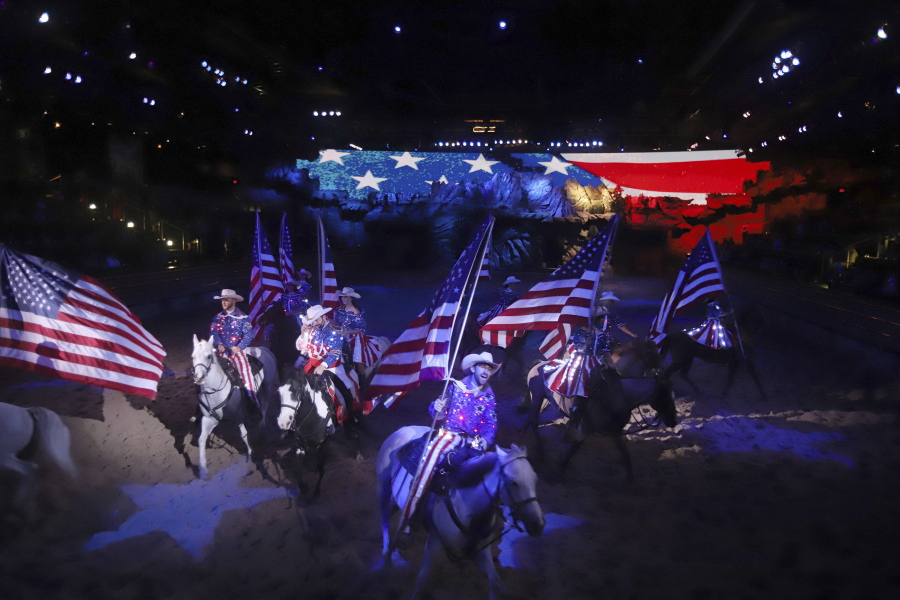 Entertainers participate in the finale at Dolly Parton's Stampede dinner show on Aug. 26 in Branson, Mo. For more than a century, weary pilgrims have sought spiritual renewal and rest from the troubles of modern life here in the heart of the Ozarks -- hoping to find a nostalgic vision of a beautiful America.