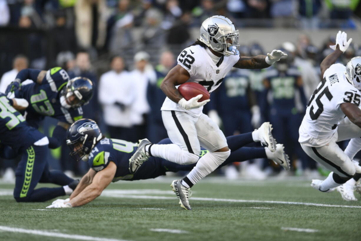 Las Vegas Raiders running back Ameer Abdullah carries against the Seattle Seahawks during the first half of an NFL football game Sunday, Nov. 27, 2022, in Seattle.
