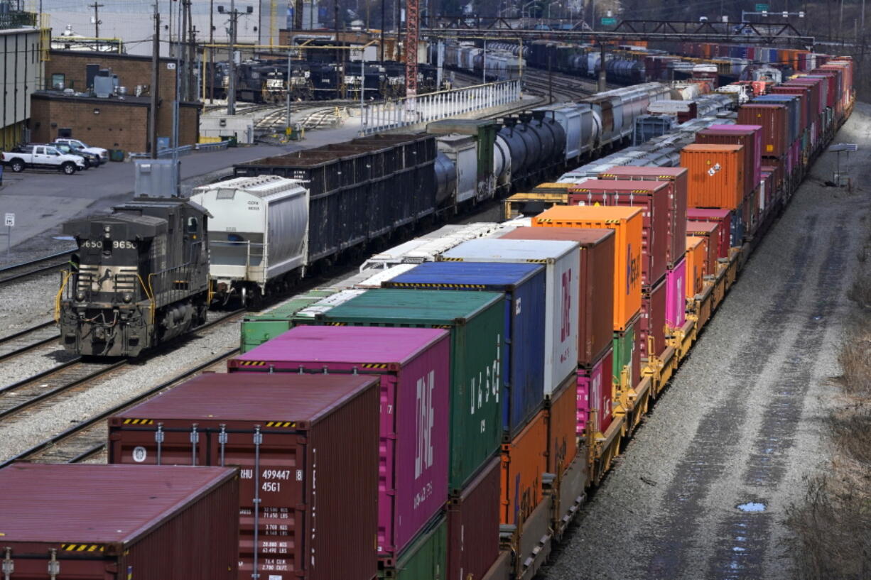FILE - Freight train cars and containers at Norfolk Southern Railroad's Conway Yard in Conway, Pa., April 2, 2021. President Joe Biden's call for Congress to intervene in the railroad contract dispute undercuts the unions' efforts to address workers' quality of life concerns, but businesses stress that it is crucial to avoid a strike that would devastate the economy. (AP Photo/Gene J.
