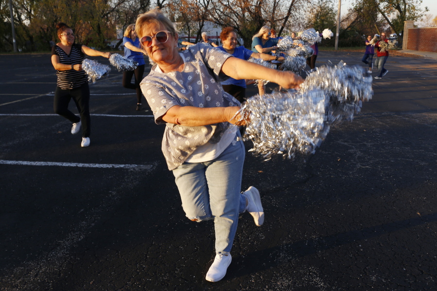 Pam Junion, 65, and other members of the Milwaukee Dancing Grannies practice in a parking lot in Milwaukee on Wednesday, Nov. 2, 2022.