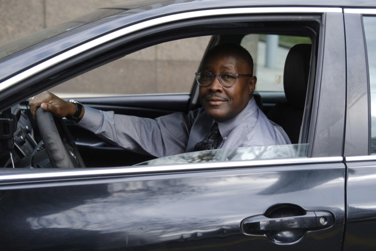 Pastor Kenneth Drayton of Mantels of Promise Ministries sits in his car Nov. 15 in New York. "You don't always have to go to a church or sanctuary to experience the restoration and the power of God," said Drayton, 61, an ordained minister who also drives part-time for a ride-hailing service.