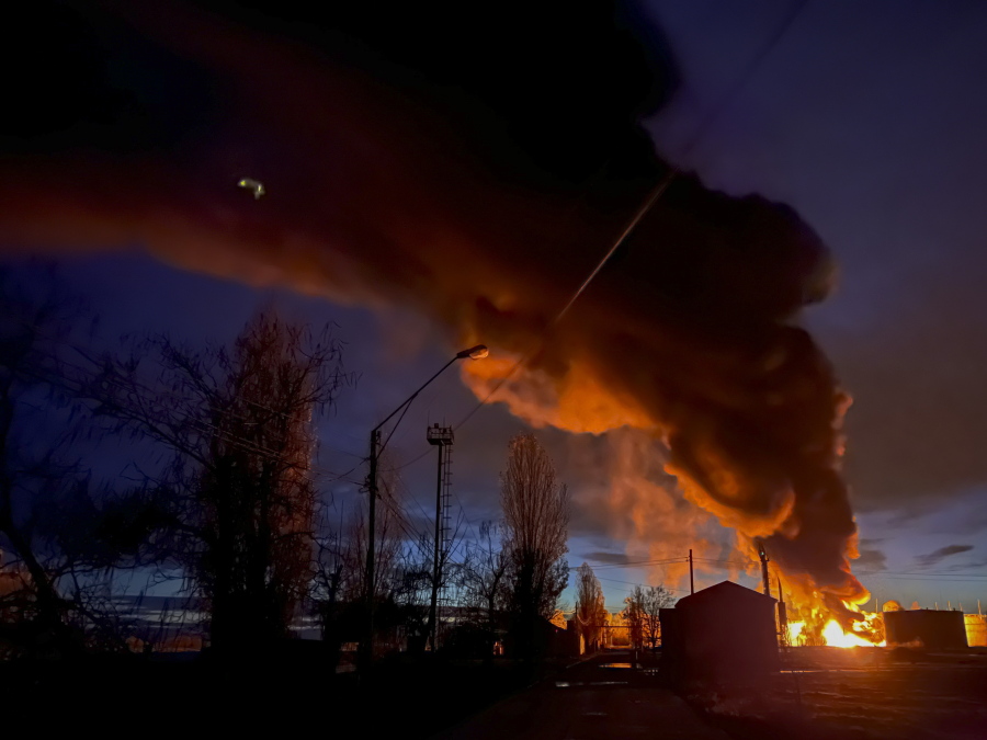 A plume of smoke rises during a fire caused by a Russian attack in Kherson, southern Ukraine, Saturday, Nov. 19, 2022.