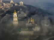 FILE - An aerial photo shows the thousand-year-old Monastery of Caves, also known as Kiev Pechersk Lavra, the holiest site of Eastern Orthodox Christians taken through morning fog during a sunrise in Kyiv, Ukraine, Saturday, Nov. 10, 2018. Ukraine's counter-intelligence service, police and the country's National Guard on Tuesday, Nov. 22, 2022 searched the Pechersk Lavra monastic complex, one of the most famous Orthodox Christian sites in the capital, Kyiv, after a priest spoke favorably about Russia - Ukraine's invader - during a service there.