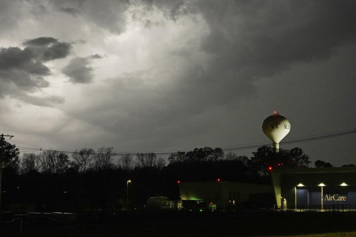 Lightning brightens the evening sky in Jackson, Miss., Tuesday, Nov. 29, 2022. Area residents were provided a light show as severe weather accompanied by some potential twisters affected parts of Louisiana and Mississippi. (AP Photo/Rogelio V.