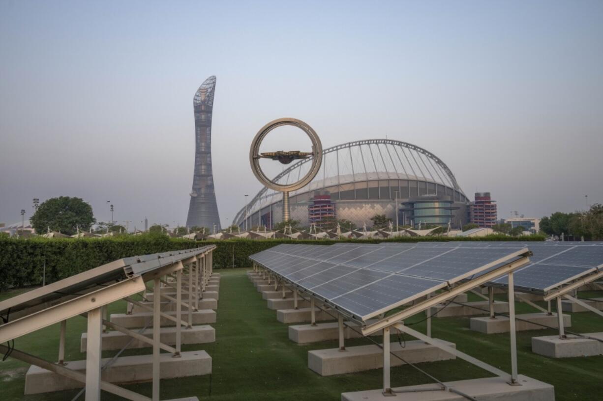 Solar panels sit in front of Khalifa International Stadium, also known as Qatar's National and oldest Stadium, which will host matches during FIFA World Cup 2022, in Doha, Qatar, Saturday, Oct. 15, 2022. Organizers of the 2022 World Cup in Qatar have said the event will be soccer's first "carbon neutral" event of its kind. FIFA and Qatari organizers say they will reduce and offset all the event's carbon emissions, which will be calculated once the games are over.