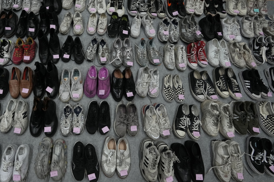 Shoes are seen among a huge collection items found in Itaewon following South Korea's deadliest crowd surge, at a temporary lost and found center at a gym in Seoul, South Korea, Tuesday, Nov. 1, 2022. Police have assembled the crumpled tennis shoes, loafers and Chuck Taylors, part of 1.5 tons of personal objects left by victims and survivors of the tragedy, in hopes that the owners, or their friends and family, will retrieve them.