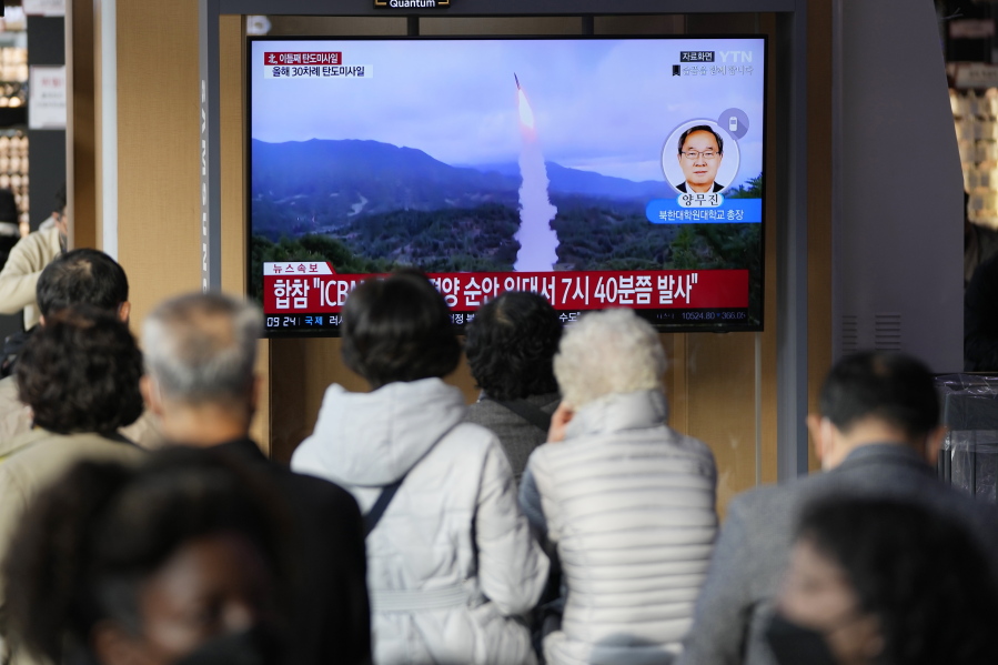 A TV screen showing a news program reporting about North Korea's missile launch with file footage is seen at the Seoul Railway Station in Seoul, South Korea, Thursday, Nov. 3, 2022. North Korea continued its barrage of weapons tests on Thursday, firing at least three missiles including a suspected intercontinental ballistic missile that forced the Japanese government to issue evacuation alerts and temporarily halt trains.