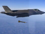 In this photo provided by South Korean Defense Ministry, South Korean Air Force F-35 fighter jet fires a GBU-12 aerial laser-guided bomb at a firing range near its land border with North Korea, South Korea, Friday, Nov. 18, 2022. South Korea's military said Friday its F-35 fighter jets conducted drills simulating aerial strikes on North Korean mobile missile launchers at a firing range near its land border with North Korea. It said a group of eight South Korean and U.S. fighter jets separately performed flight training off the Korean Peninsula's east coast.